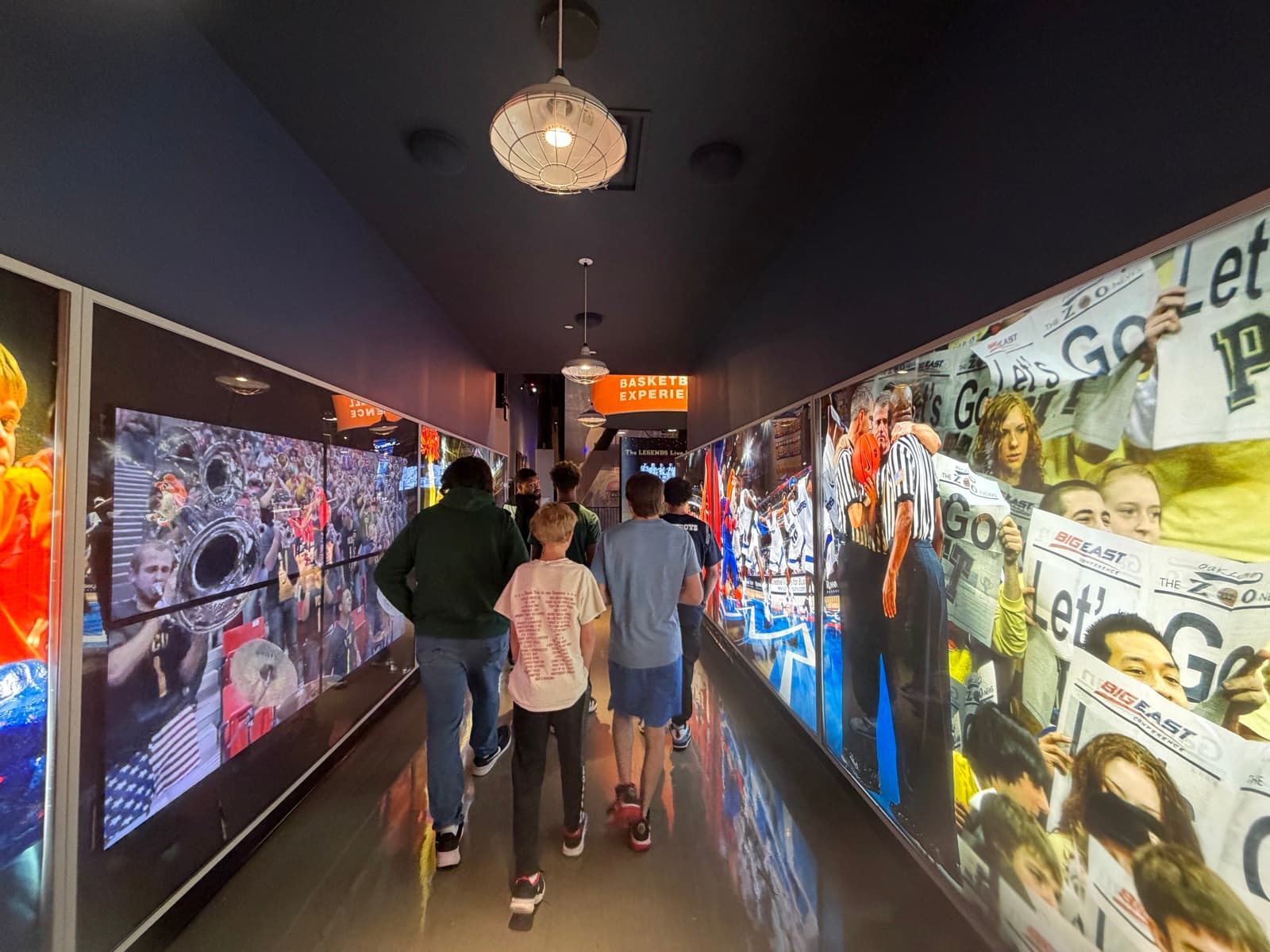 Residents exploring the College Basketball Experience