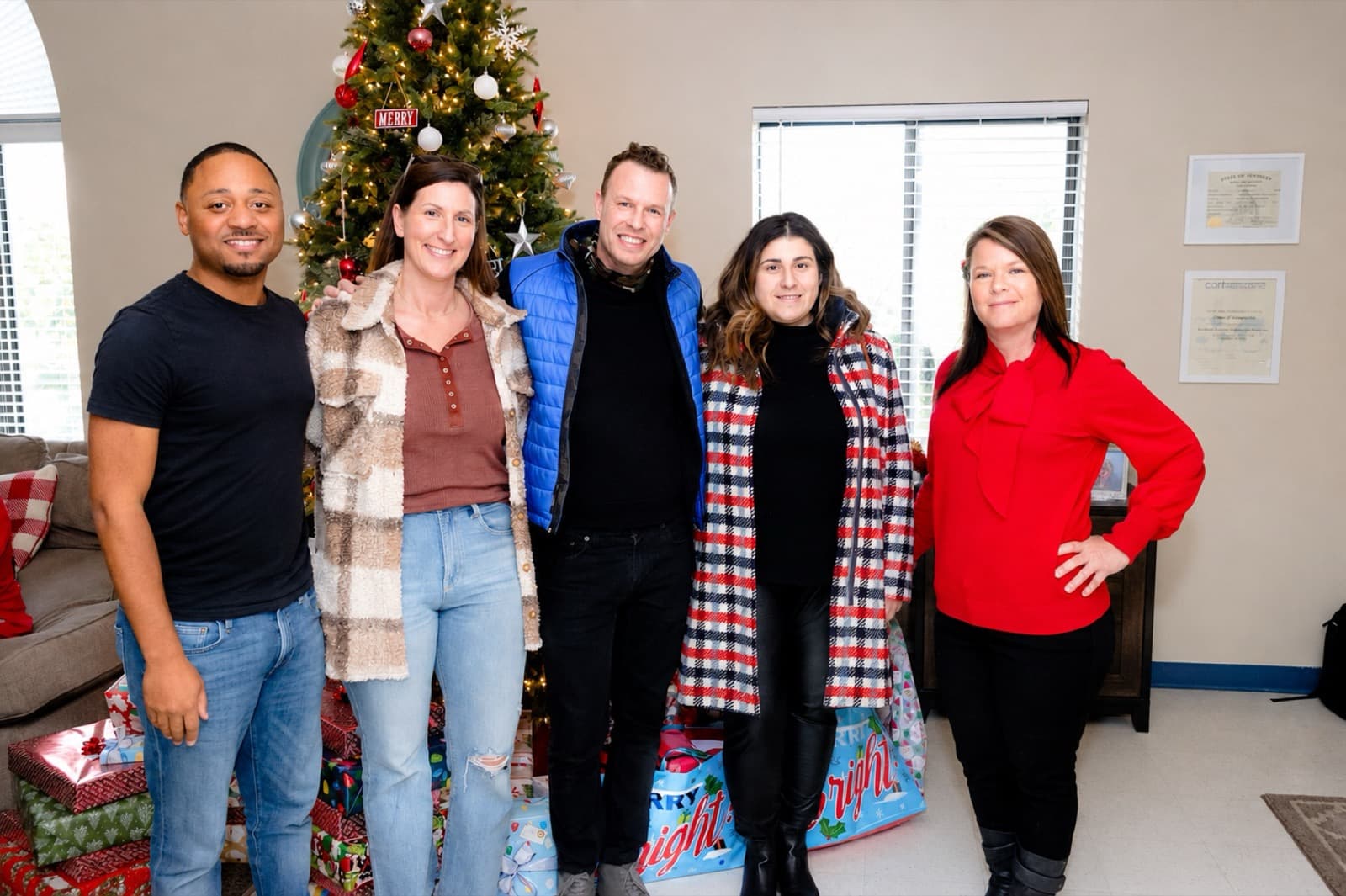 The House of Compassion team at a holiday gathering — the staff who hold the home together.