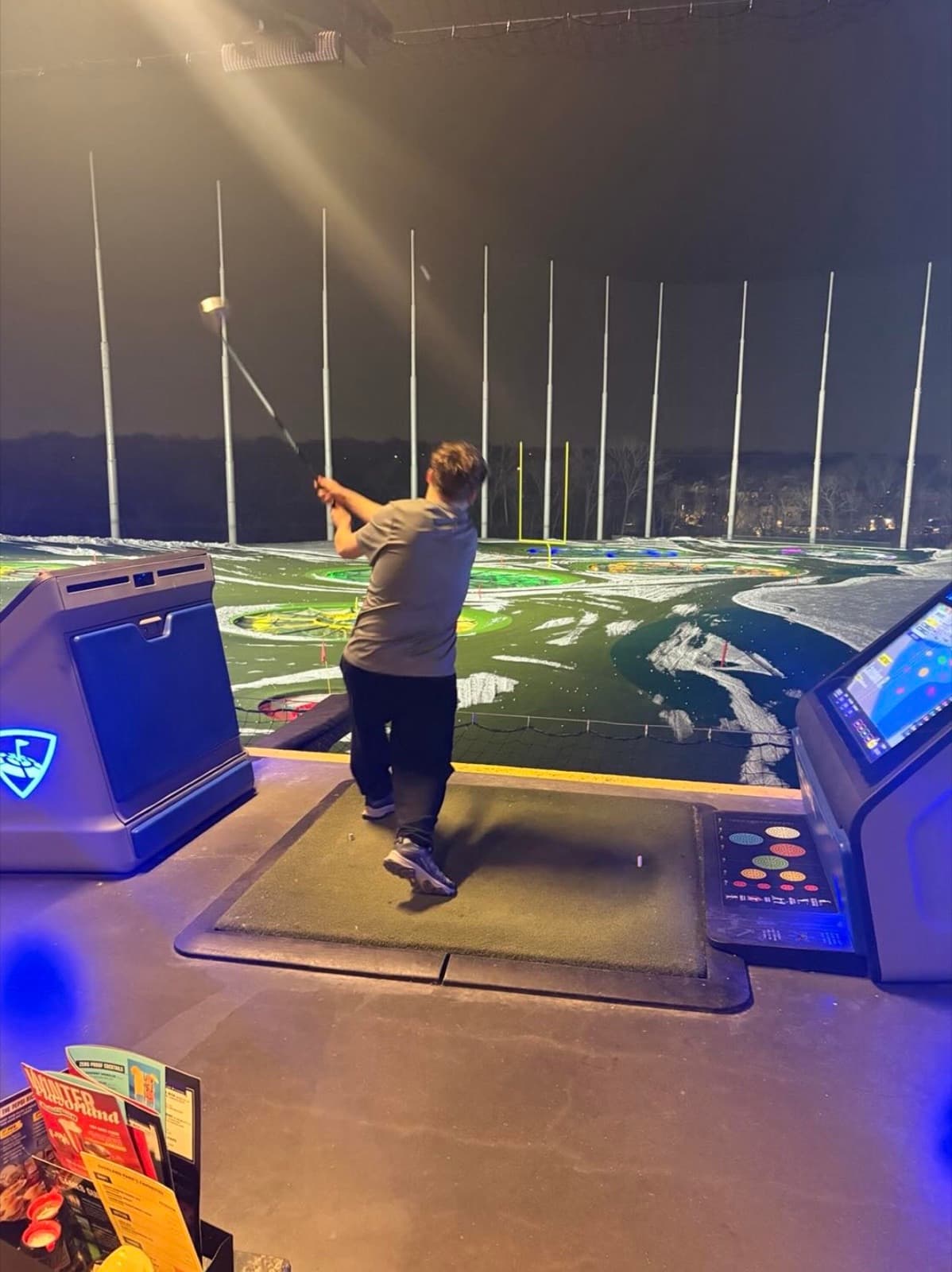 A resident taking a swing at Topgolf